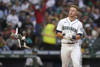 Seattle Mariners' Jarred Kelenic tosses his batting pad after striking out to end the fourth inning of the team's baseball game against the Oakland Athletics, Thursday, July 22, 2021, in Seattle. (AP Photo/Ted S. Warren)