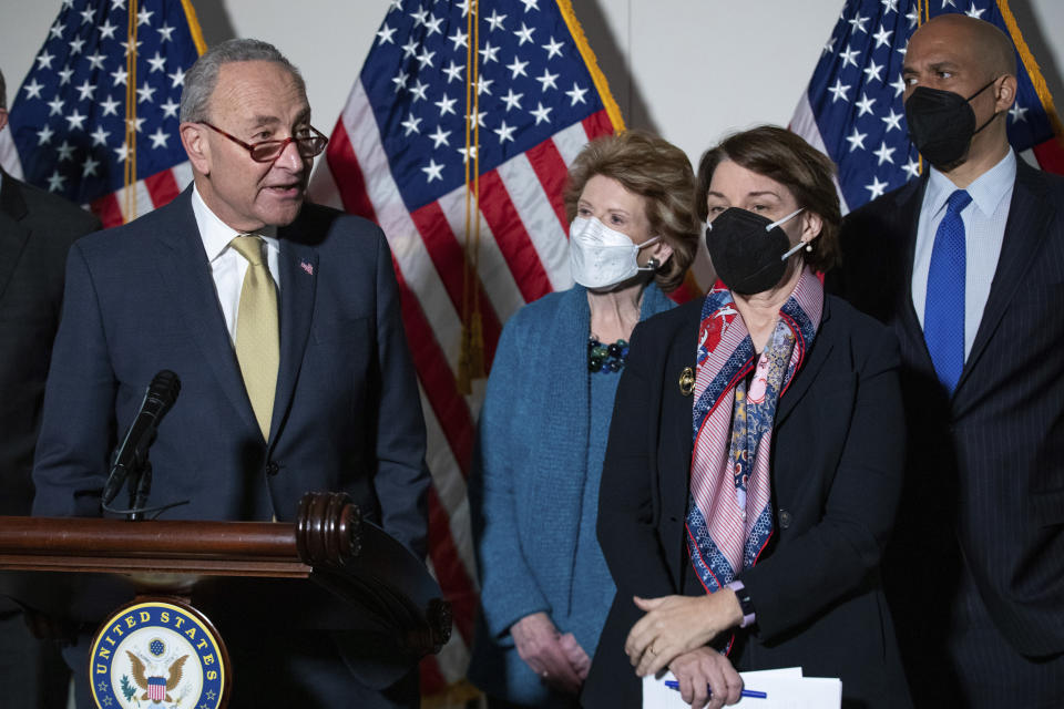 From left, Senate Majority Leader Chuck Schumer, D-N.Y., Sen. Debbie Stabenow, D-Mich., Sen. Amy Klobuchar, D-Minn., and Sen. Cory Booker, D-N.J., attend a press conference regarding the Democratic party's shift to focus on voting rights at the Capitol in Washington, Tuesday, Jan. 18, 2022. (AP Photo/Amanda Andrade-Rhoades)