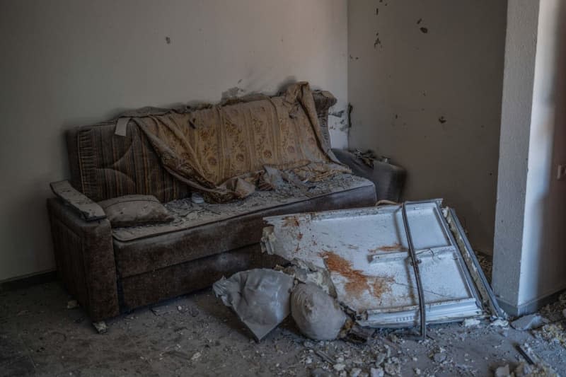 Damages are seen inside a building following a rocket from Lebanon hit a house in Safed. Ilia Yefimovich/dpa