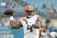 Cleveland Browns quarterback Deshaun Watson (4) warm up before an NFL preseason football game against the Jacksonville Jaguars, Friday, Aug. 12, 2022, in Jacksonville, Fla. (AP Photo/Phelan M. Ebenhack)