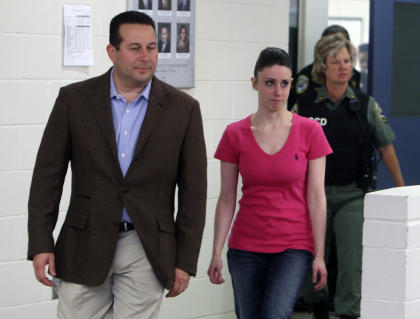 Casey Anthony, front right, walks out of the Orange County Jail with her attorney Jose Baez on July 17, 2011. (AP file photo)