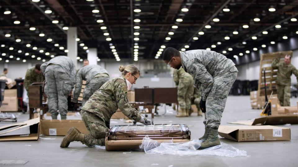 <div class="inline-image__title">HEALTH-CORONAVIRUS/USA</div> <div class="inline-image__caption"><p>"Members of the Michigan National Guard set up hospital beds as the Detroit TCF convention center is converted into a field hospital amid an outbreak of coronavirus disease (COVID-19) in Detroit, Michigan."</p></div> <div class="inline-image__credit">Emily Elconin/Reuters</div>