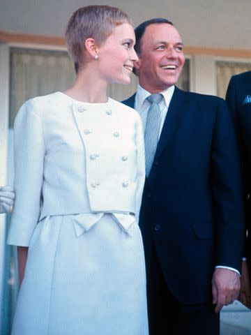 <p>Bettmann</p> Frank Sinatra and Mia Farrow following their wedding on July 19, 1966.