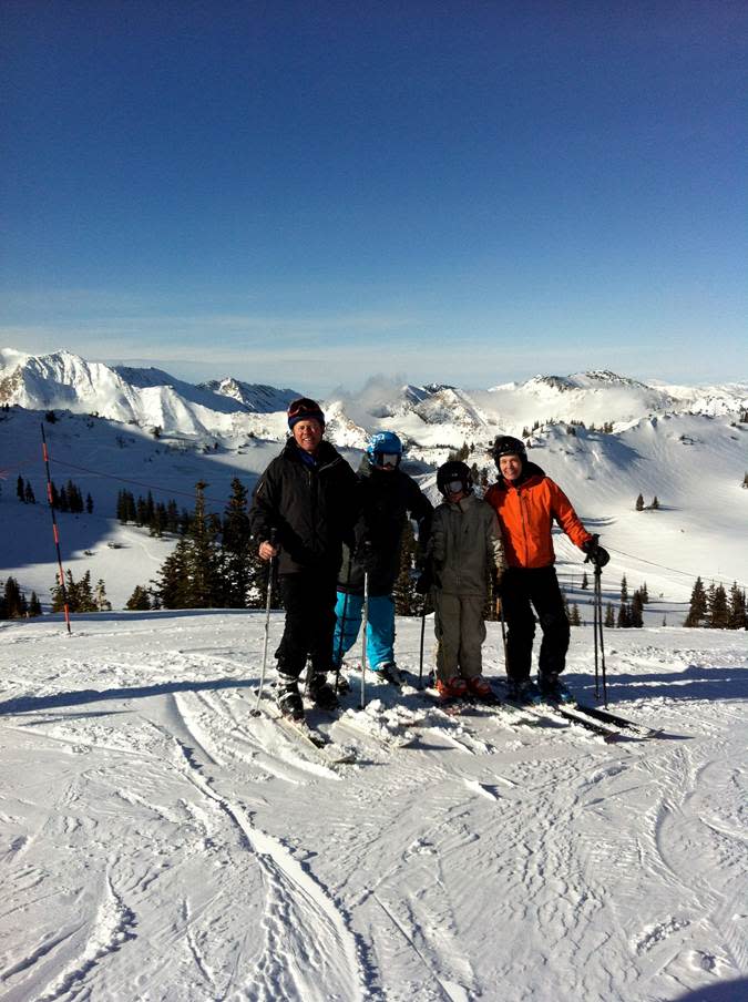 This Jan. 22, 2012 photo provided by the Killoran family shows Steve and Sue Killoran and their two children skiing in Alta, Utah. The Killorans brought their own skis but found that the gear they use near their home in Vermont wasn’t well-suited to the Utah slopes’ powder. They ended up renting wider, high-performance skis for their son, as some skiers routinely do now, even when they own their own skis. Renting onsite means you get the latest gear for local conditions. (AP Photo/Leslie Baker Brown)