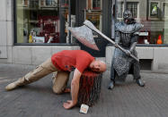 <p>An artist called “Le Bourreau/The Headsman” takes part in the festival “Statues en Marche” in Marche-en-Famenne, Belgium, July 22, 2018. (Photo: Yves Herman/Reuters) </p>