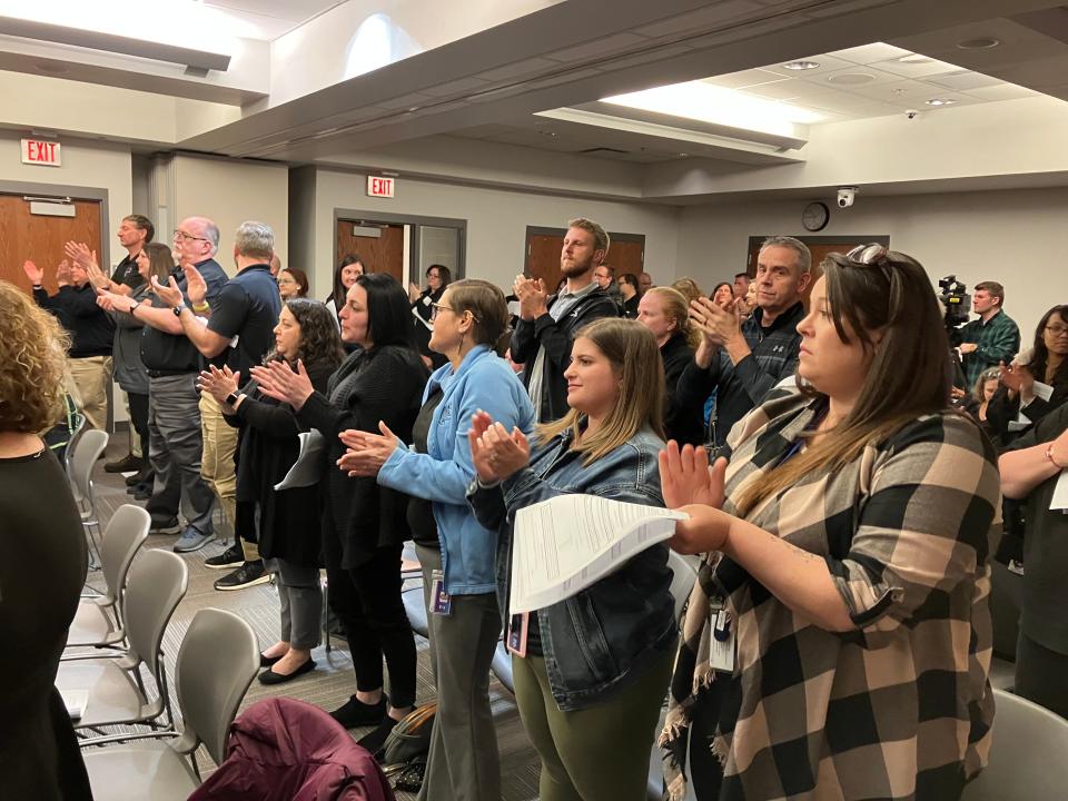 An audience including many teachers applauds during the Feb. 26, 2024, East Stroudsburg school board meeting, at which the board unanimously passed a six-year contract including raises.