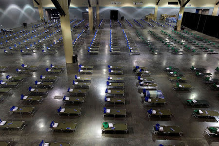 Camp beds are set up at a convention centre for Caribbean refugees whose homes were destroyed by Hurricane Irma, in San Juan, Puerto Rico September 14, 2017. REUTERS/Alvin Baez