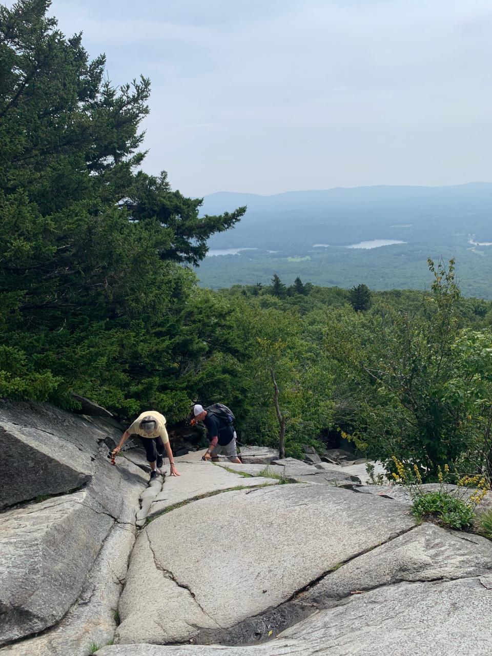 Jean and Art Holden scamper over the granite rock en route to the top of Mount Monadnock in southwestern New Hampshire.