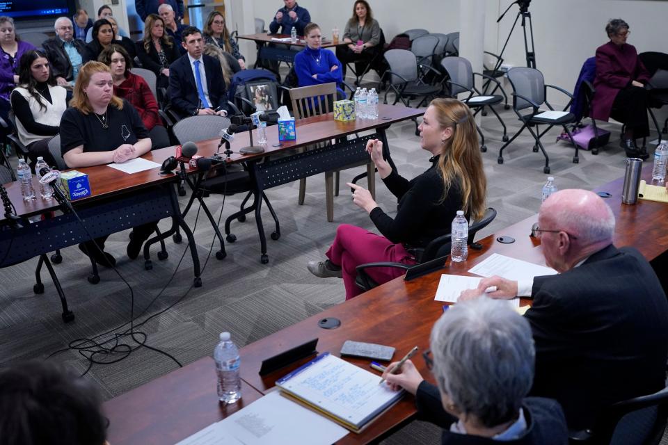 Vozzella, who is deaf, used a sign language interpreter to testify to the commission.