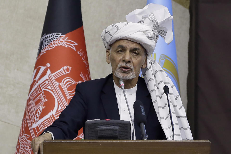 FILE - In this March 6, 2021, file photo, Afghan President Ashraf Ghani speaks during the opening ceremony of the new legislative session of the Parliament in Kabul, Afghanistan. Ghani has made two key Cabinet changes, evoking a strong response Saturday, March 20, 2021 from powerful governing partner Abdullah Abdullah amid increasing pressure from the U.S. to reach a peace agreement with the Taliban. (AP Photo/Mariam Zuhaib, File)