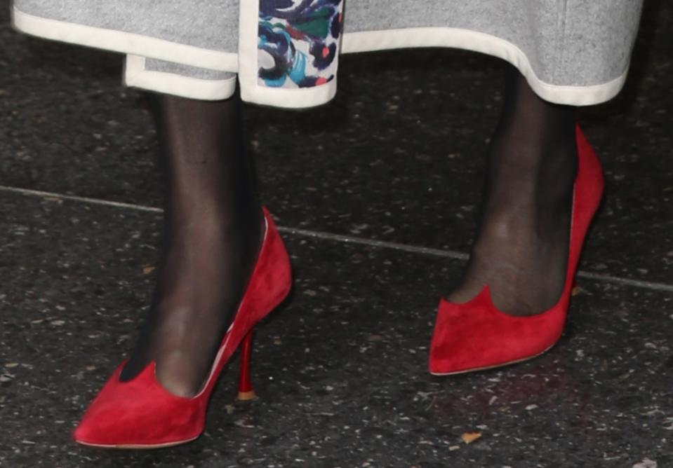 A closer look at Meryl Streep wearing a bright pair of red velvet pumps featuring a scalloped design. - Credit: Splash