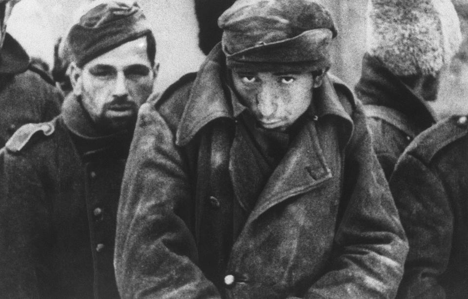 FILE - Captured German and other Axis soldiers huddle against the wind at Stalingrad, now Volgograd, Russia in Feb. 19, 1943. World War II inflicted colossal suffering on the Soviet Union, but cemented its status as a superpower and swelled citizens' hearts with the conviction that it was a virtuous and indomitable nation. An estimated 27 million Soviets died in the conflict. The Battle of Stalingrad was one of the bloodiest in the history of warfare. (Soviet Newsreels Picture via AP, File)