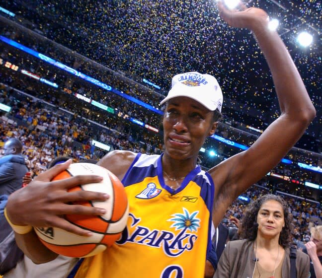 Los Angeles Sparks' Lisa Leslie celebrates a win against New York Liberty 69-66 in the WNBA Finals championship in 2002.