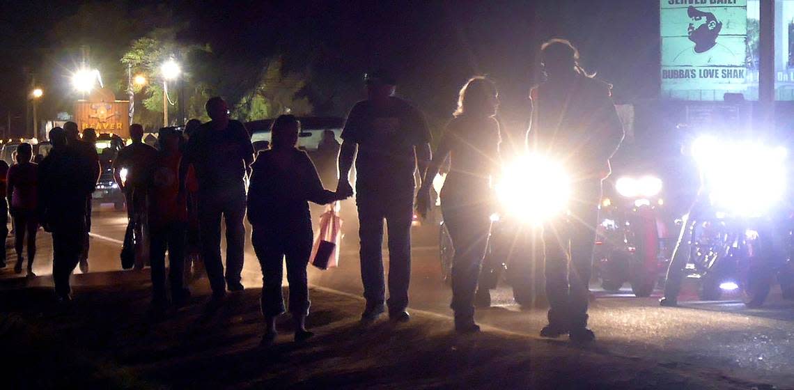 After parking, folks walk from bar to bar in Murrells Inlet for the 2022 Bike Week Spring Rally.