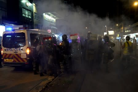 Riot police officers are seen on the street in Tuen Mun, Hong Kong