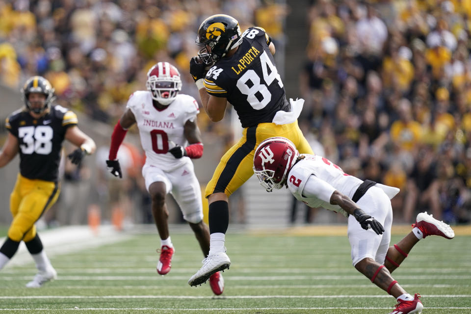 Iowa tight end Sam LaPorta (84) catches a pass over Indiana defensive back Reese Taylor (2) during the first half of an NCAA college football game, Saturday, Sept. 4, 2021, in Iowa City, Iowa. (AP Photo/Charlie Neibergall)