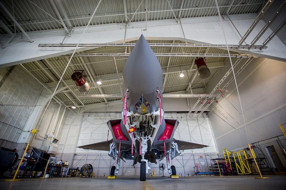 A new Lockheed Martin F-35A Lightning ll multirole fighter jet parked in a hangar as it is presented to media at the Lockheed Martin factory in Fort Worth.