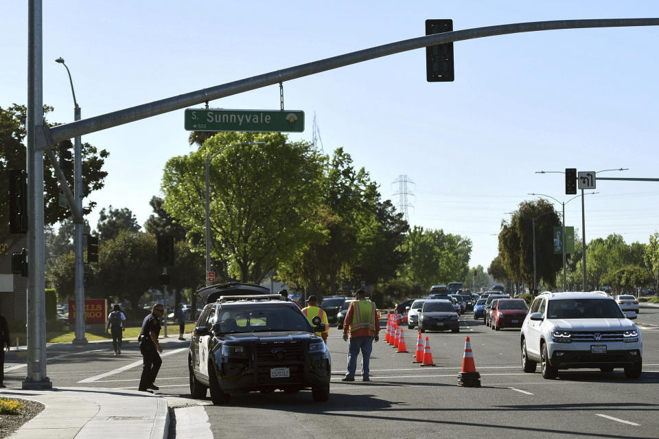 Police investigate the scene of car crash at the intersection of El Camino Real and Sunnyvale Road in Sunnyvale, Calif., on Wednesday, April 24, 2019. Investigators are working to determine the cause of the crash in Northern California that injured several pedestrians on Tuesday evening. Authorities say the driver of the car was taken into custody after he appeared to deliberately plow into the group. (AP Photo/Cody Glenn)