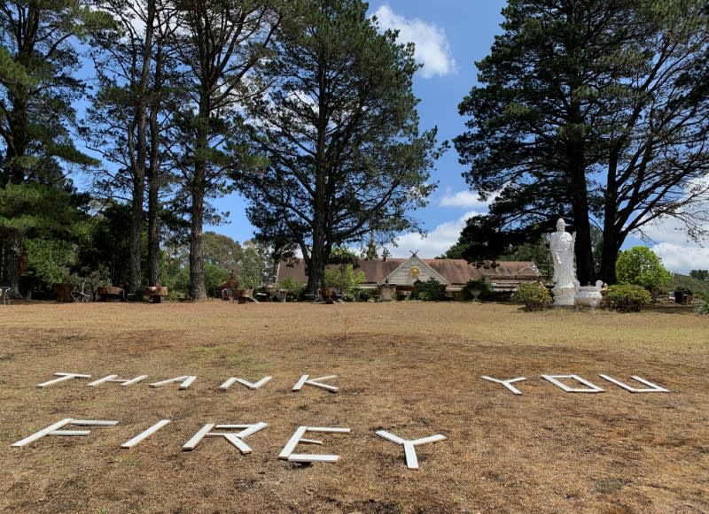 The message "Thank you Firey" is arranged on the ground of Sunnataram Forest Monastery to thank firefighters combating forest fires in Bundanoon