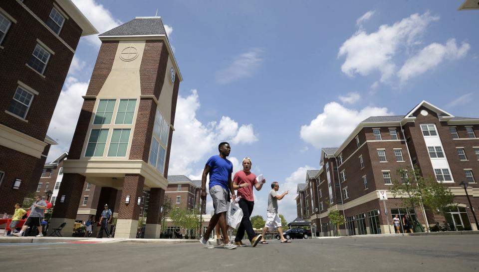 People walk through Campus Town at The College of New