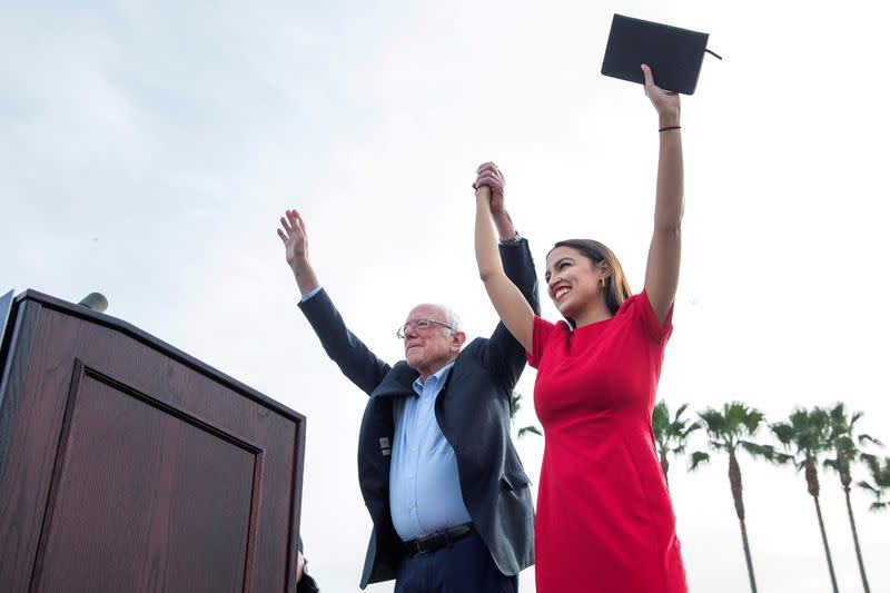 FILE PHOTO: U.S. Senator Bernie Sanders and Representative Alexandria Ocasio-Cortez during a campaign rally at Venice Beach in Los Angeles, California