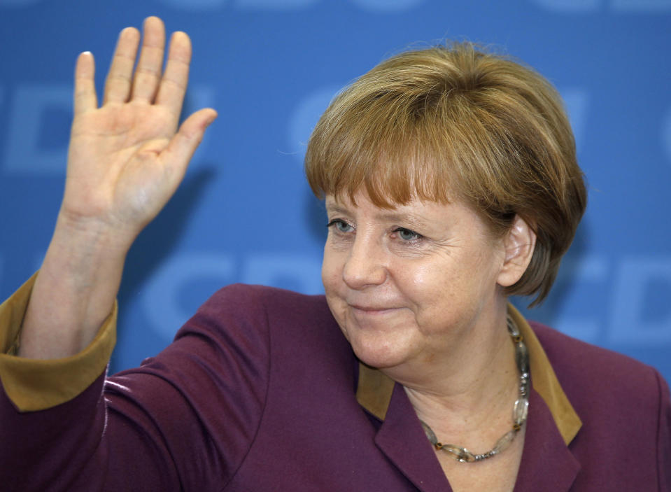 German Chancellor and chairwoman of the German Christian Democrats, CDU, Angela Merkel,waves at the beginning of the party's weekly executive committee meeting in Berlin, Germany, Monday, March 26, 2012 one day after the Saarland state elections. Chancellor Angela Merkel's party won the state election in western Germany Sunday, making a promising start to a difficult series of regional ballots this year. (AP Photo/Michael Sohn)