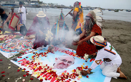 Peruvian shamans perform a ritual prior to the arrival of Pope Francis to Peru, at Pescadores beach in Chorrillos, Lima, Peru January 17, 2018. REUTERS/Guadalupe Pardo