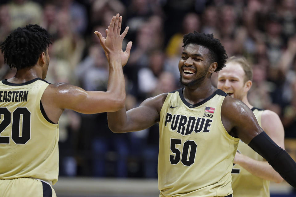 Purdue forward Trevion Williams (50) celebrates with guard Nojel Eastern (20) during the second half of an NCAA college basketball game against Michigan State in West Lafayette, Ind., Sunday, Jan. 12, 2020. (AP Photo/Michael Conroy)