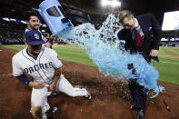 <p>San Diego Padres’ Hunter Renfroe, left, dodges energy drink dumped by teammate Austin Hedges after hitting a walk-off home run during the tenth inning of a baseball game against the Milwaukee Brewers, May 15, 2017, in San Diego. A reporter ready to interview Renfroe stands by at right. The Padres won, 6-5. (Photo: Gregory Bull/AP) </p>