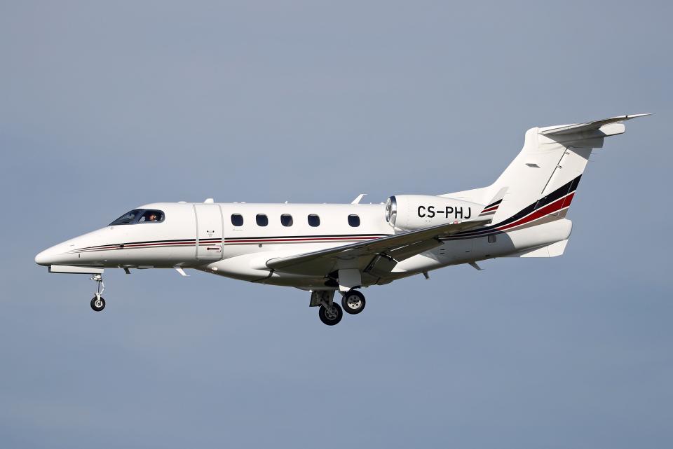 Embraer 505 Phenom 300 aircraft, of a NetJets Europe company, getting ready to land at Barcelona airport, in Barcelona on 04th January 2022