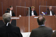 Presiding judge Hofmeijer-Rutten, center, prepares to read the verdict in a Dutch appeals court in Amsterdam, Tuesday Oct. 26, 2021, on ownership of a trove of Crimean historical artifacts that were loaned to an Amsterdam museum shortly before Russia annexed the region. A lower court ruled in 2016 that the treasures should be handed to the Ukrainian government. (AP Photo/Peter Dejong, file)