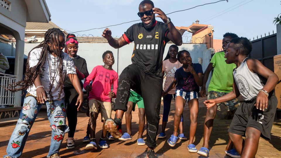 Eddy Kenzo (center) pictured here in Uganda with members of the Ghetto Kids dance group, during a music video rehearsal in 2023. - Badru Katumba/AFP via Getty Images