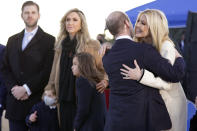 Ivanka Trump hugs White House adviser Stephen Miller as Eric Trump and his wife Lara Trump and their children wait for President Donald Trump and first lady Melania Trump to arrive at Andrews Air Force Base, Md., Wednesday, Jan. 20, 2021.(AP Photo/Manuel Balce Ceneta)