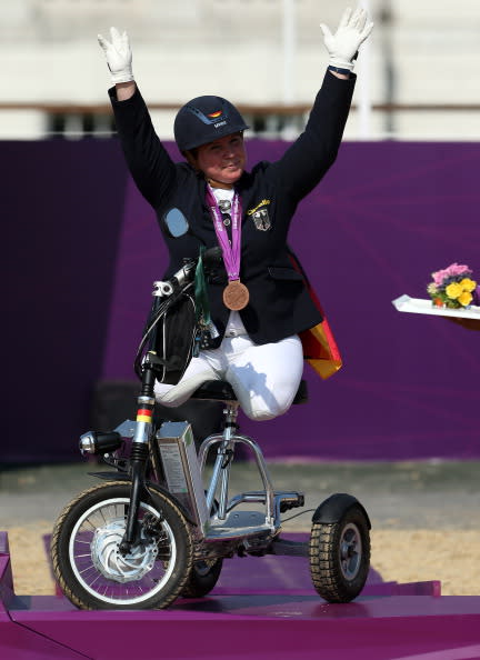 Angelika Trabert of Germany celebrates taking bronze in the Dressage Individual Freestyle Test, Grade II in the Equestrain on day 5 of the London 2012 Paralympic Games at Greenwich Park on September 3, 2012 in London, England. (Photo by Julian Finney/Getty Images)