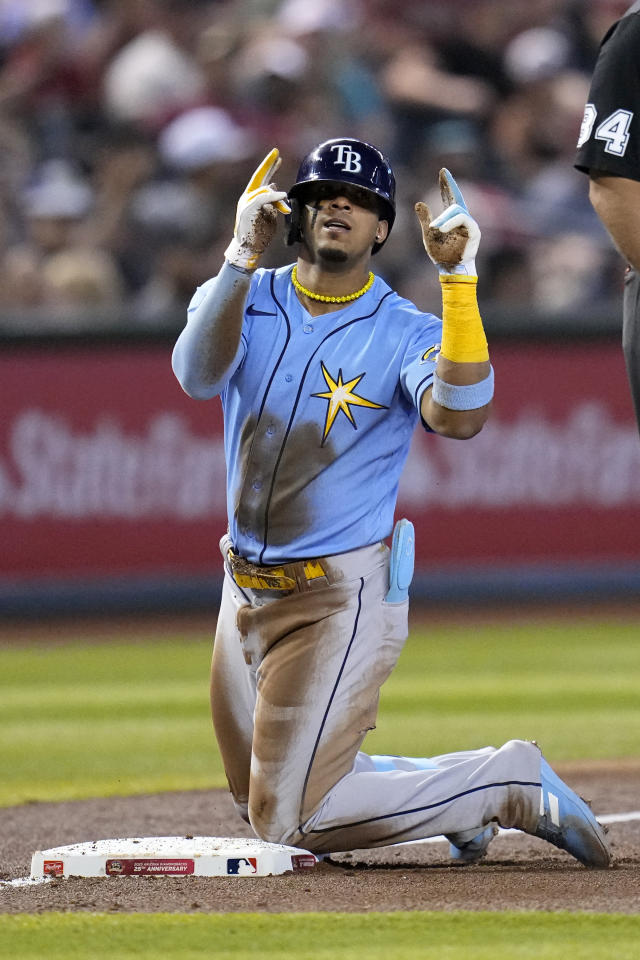 Tampa Bay Rays pitcher Phoenix Sanders, left, throws to first base