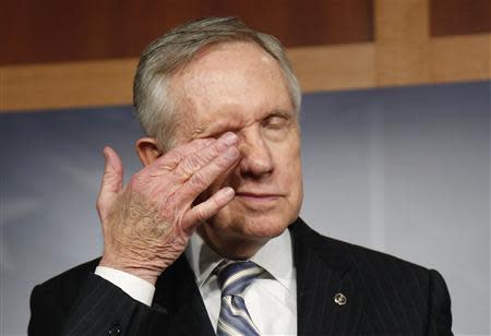 U.S. Senate Majority Leader Harry Reid (D-NV) rubs his eyes during a news conference after a bipartisan passage of a budget and debt legislation at the U.S. Capitol in Washington, October 16, 2013. REUTERS/Jonathan Ernst