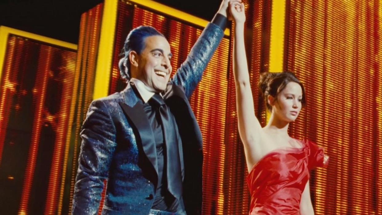  Caesar Flickerman and Katniss Everdeen in The Hunger Games. 