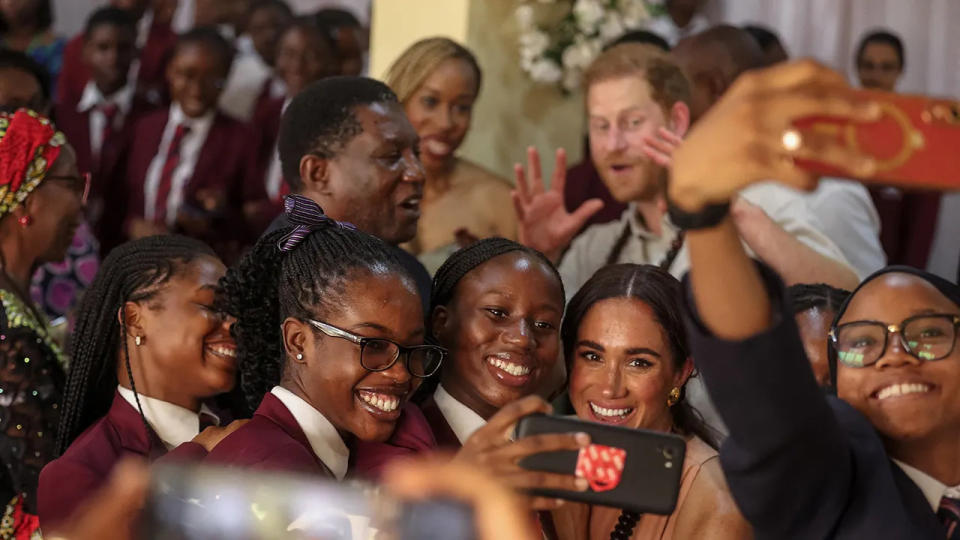 Meghan Markle and Prince Harry taking a selfie