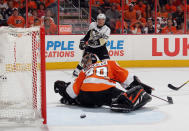 PHILADELPHIA, PA - APRIL 15: A third period shot by Sidney Crosby #87 of the Pittsburgh Penguins goes through Ilya Bryzgalov #30 of the Philadelphia Flyers but wide of the net in Game Three of the Eastern Conference Quarterfinals during the 2012 NHL Stanley Cup Playoffs at Wells Fargo Center on April 15, 2012 in Philadelphia, Pennsylvania. The Flyers defeated the Penguins 8-4. (Photo by Bruce Bennett/Getty Images)