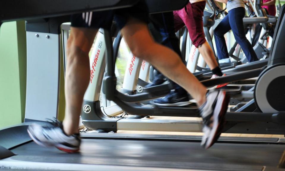 Running on the treadmill at a busy gym