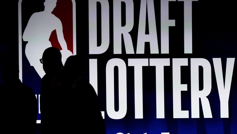 People walk by a sign during the NBA basketball draft lottery in Chicago, Tuesday, May 16, 2023. The Utah Jazz didn’t strike gold in the lottery this year, but have the assets to move up in the draft if desired. 