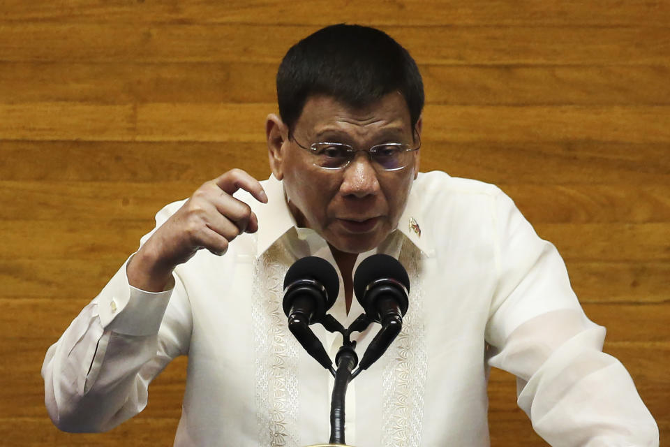 Philippine President Rodrigo Duterte gestures as he delivers his final State of the Nation Address at the House of Representatives in Quezon City, Philippines on Monday, July 26, 2021. Duterte delivered his final State of the Nation speech Monday before Congress, winding down his six-year term amid a raging pandemic, a battered economy and a legacy overshadowed by a bloody anti-drug crackdown that set off complaints of mass murder before the International Criminal Court. (Lisa Marie David/Pool Photo via AP)