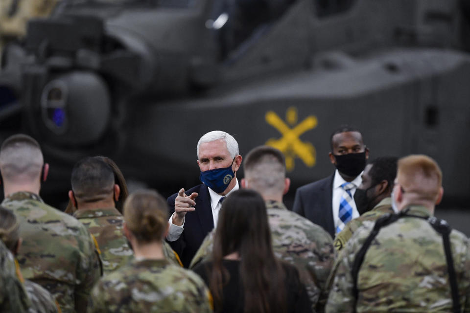 Vice President Mike Pence meets with soldiers following his remarks to the Army's 10th Mountain Division, many of whom have recently returned from Afghanistan, in Fort Drum, N.Y., Sunday, Jan. 17, 2021. (AP Photo/Adrian Kraus)