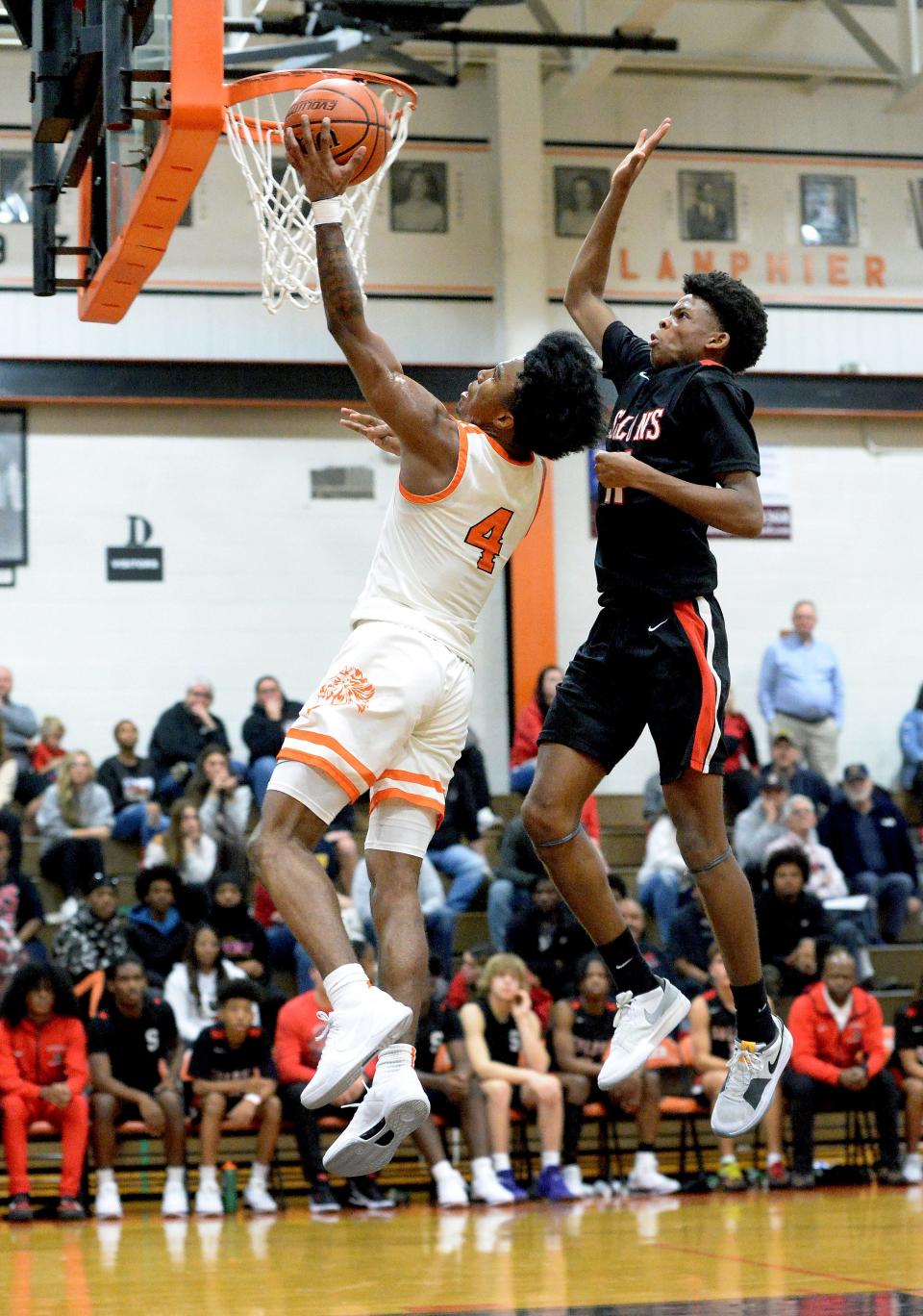 Lanphier's Jaiquan Holman goes up for a shot while being guarded by Springfield's Jaiyden Wilson during the game Friday, Dec. 8, 2023.