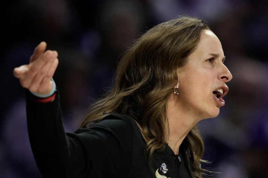 Colorado head coach JR Payne talks to her players during the first half of a second-round college basketball game against Kansas State in the women’s NCAA Tournament in Manhattan, Kan., Sunday, March 24, 2024, in Manhattan, Kan. (AP Photo/Charlie Riedel)