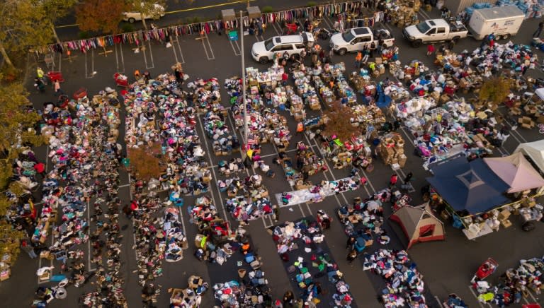 Fire evacuees sift through a surplus of donated items at a parking lot in Chico, California