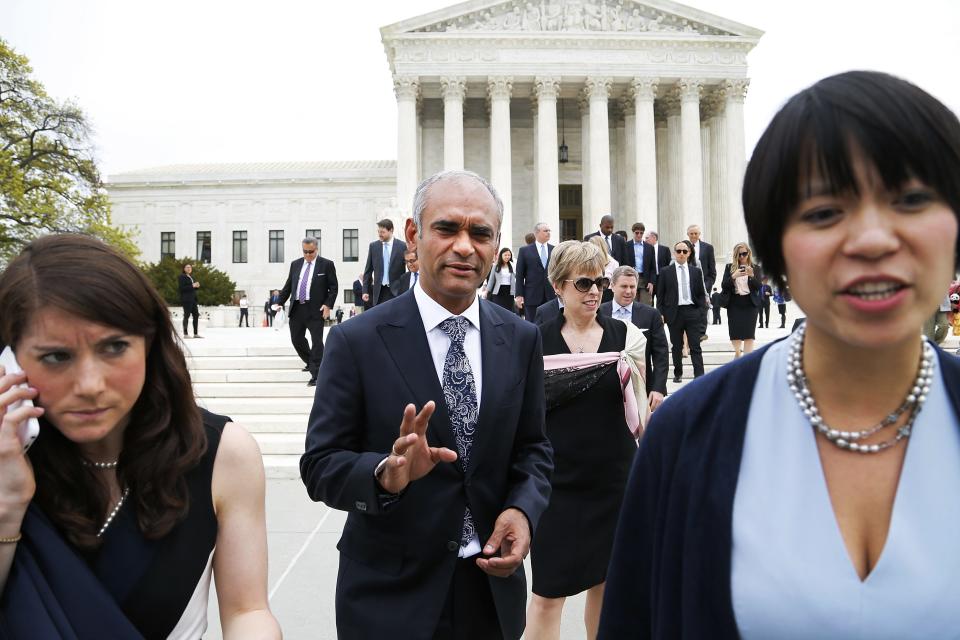 Aereo CEO and founder Chet Kanojia (C) departs the U.S. Supreme Court in Washington April 22, 2014. The court heard an appeal filed by the four major broadcasters, who say the online TV startup Aereo Inc steals copyrighted content, and the case is being closely watched due to concerns that a ruling against Aereo could call into question cloud computing services, in which personal files, including TV shows, are stored remotely on the internet. REUTERS/Jonathan Ernst (UNITED STATES - Tags: CRIME LAW BUSINESS MEDIA)