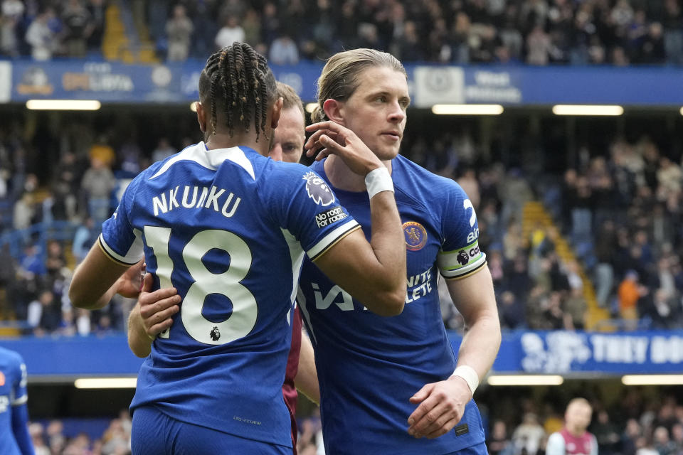 Chelsea's Conor Gallagher, right, and Chelsea's Christopher Nkunku at the end of the English Premier League soccer match between Chelsea and West Ham United at Stamford Bridge stadium in London, England, Sunday, May 5, 2024. (AP Photo/Frank Augstein)