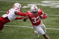 Nebraska defensive back Cam Taylor-Britt, left, forces Ohio State running back Master Teague out of bounds during the first half of an NCAA college football game Saturday, Oct. 24, 2020, in Columbus, Ohio. (AP Photo/Jay LaPrete)