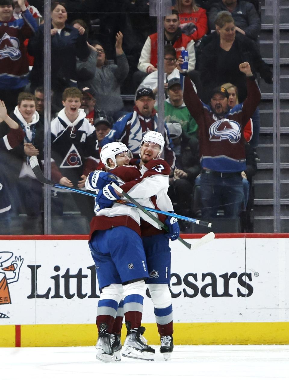 Colorado Avalanche center Lars Eller, left, celebrates his third period goal against the Detroit Red Wings with right wing Valeri Nichushkin during an NHL hockey game Saturday, March 18, 2023, in Detroit. (AP Photo/Duane Burleson)